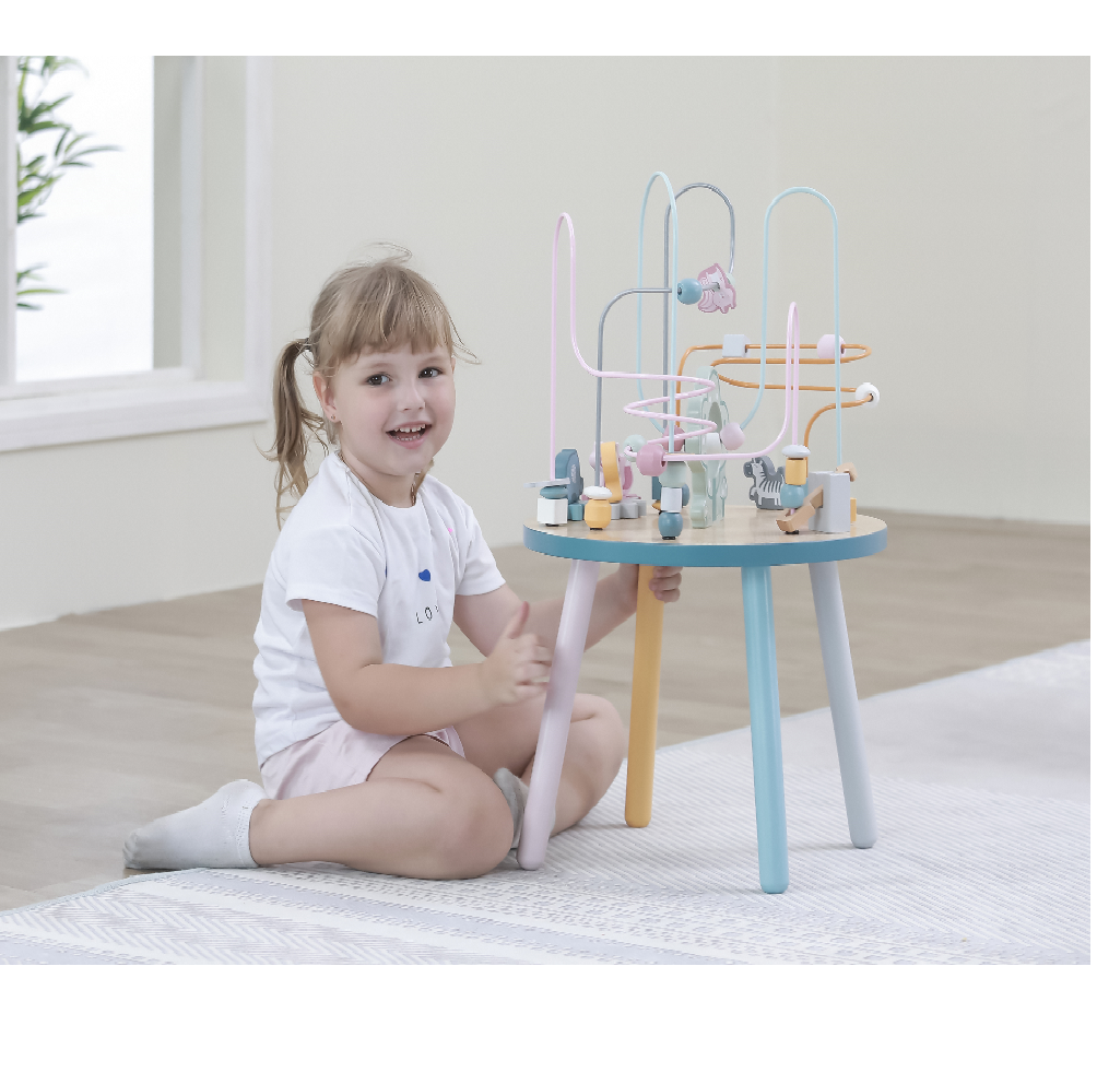 child playing at wire beads table